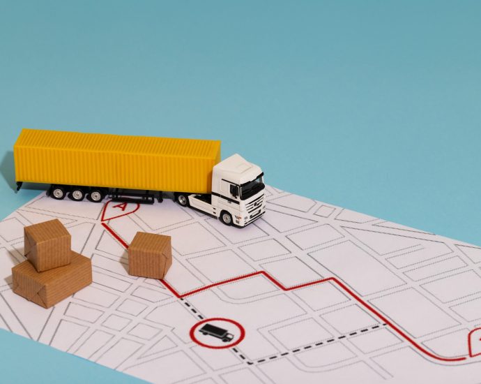 Delivery truck model on a mapped route with packages, illustrating real-time logistics optimization using predictive analytics and intelligent route planning.