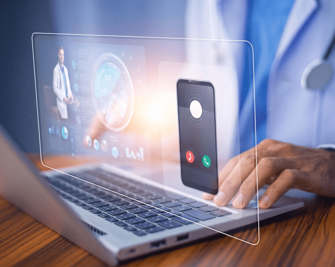Doctor using a laptop with an AI-powered healthcare interface showing virtual call options, analytics dashboard, and digital medical data visualization.