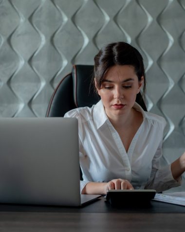 Business professional reviewing expenses and calculating cloud costs, emphasizing financial control, budget management, and usage governance strategies