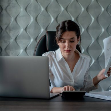 Business professional reviewing expenses and calculating cloud costs, emphasizing financial control, budget management, and usage governance strategies
