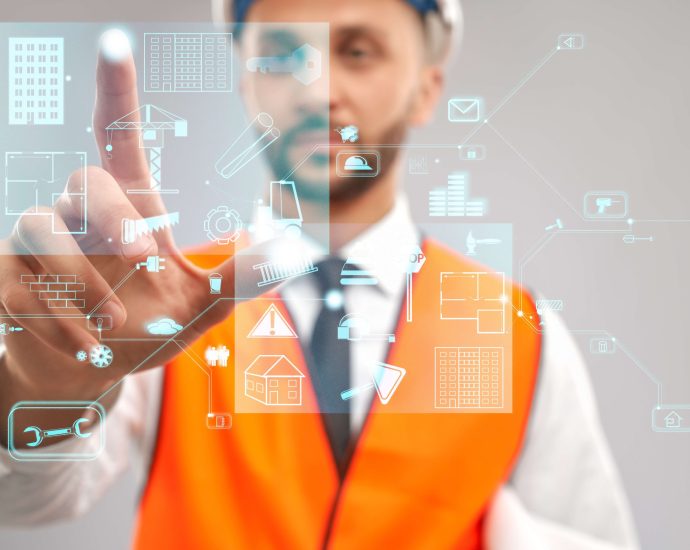 Engineer using augmented reality interface to interact with a digital twin model for smart construction planning and real-time IoT data integration.