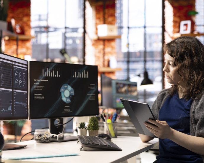 Professional analyzing real-time business data dashboards using LLM orchestration and predictive analytics to streamline SME workflows and reduce operational inefficiencies.